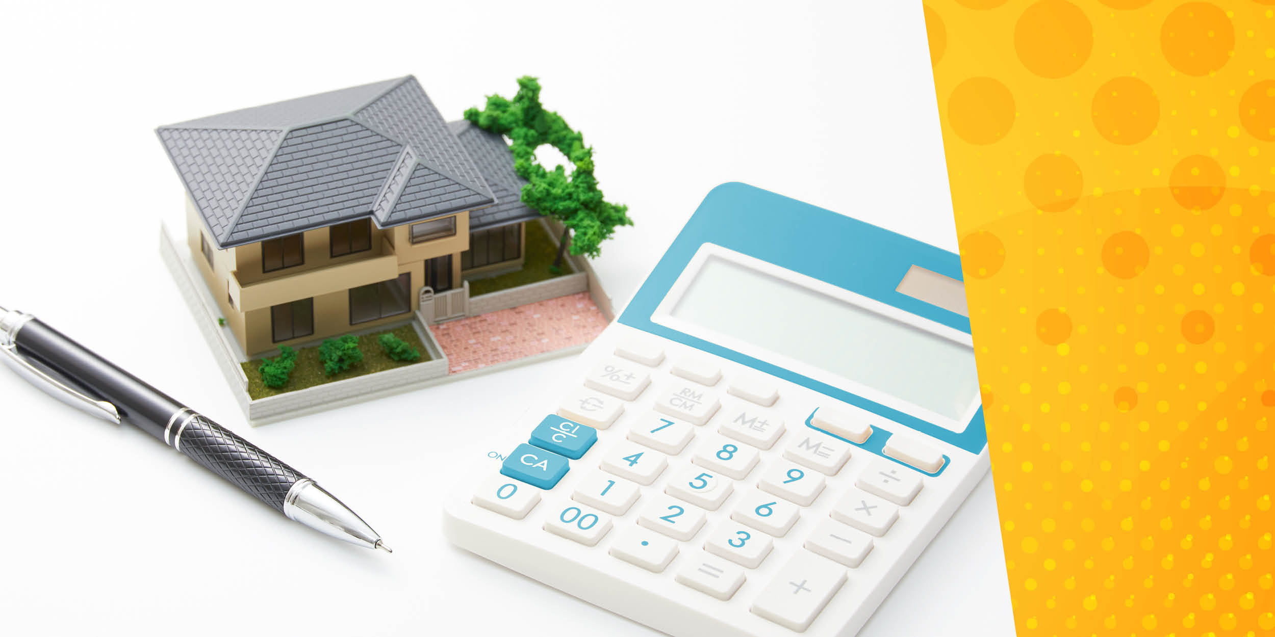 Miniature model house, calculator and pen with yellow spotted background